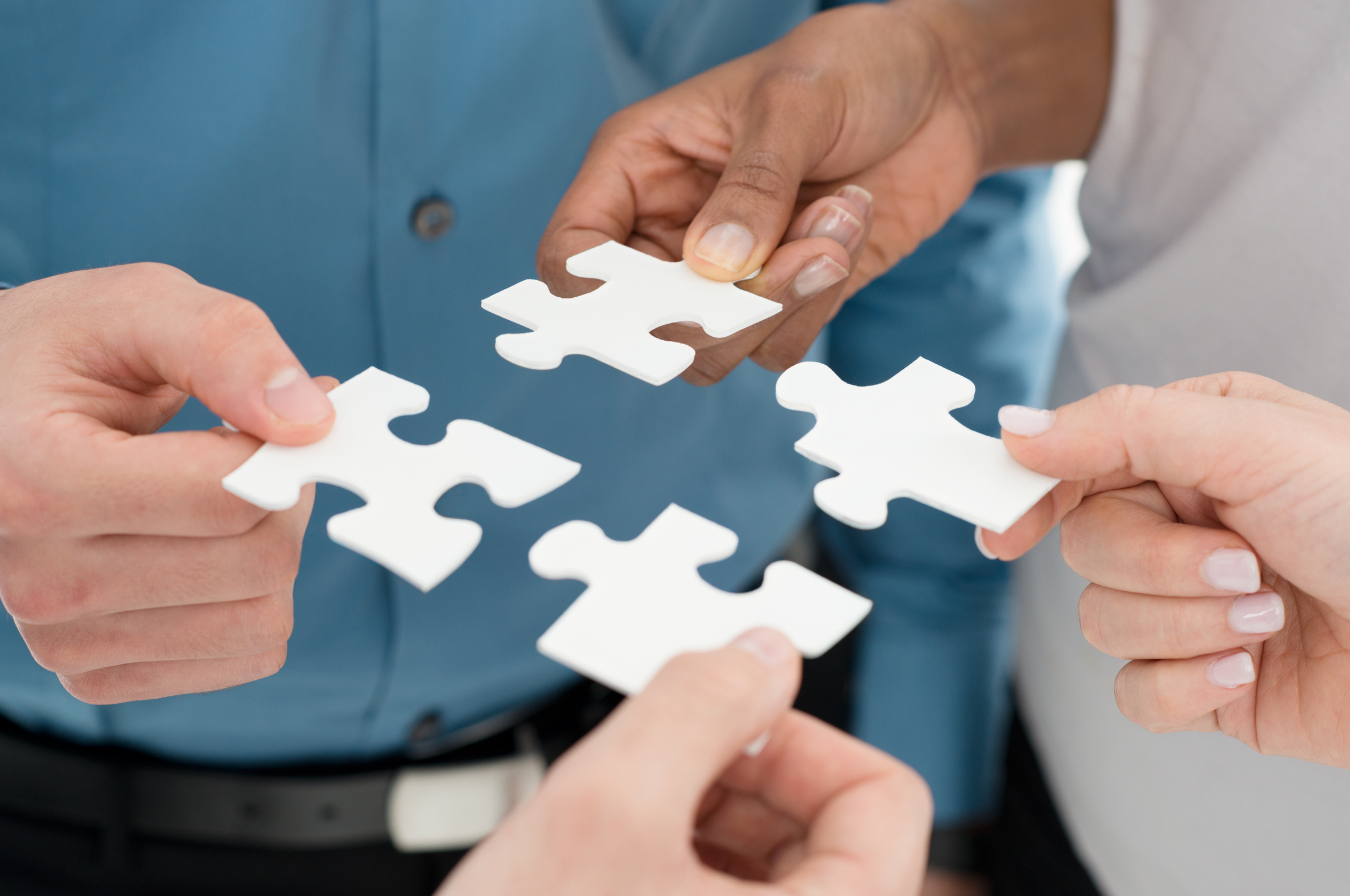 Closeup Businesspeople Hand Holding Jigsaw Puzzle